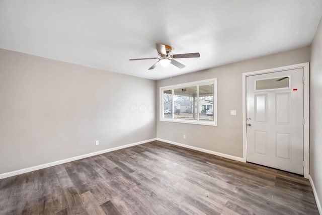 foyer featuring dark wood-type flooring and ceiling fan