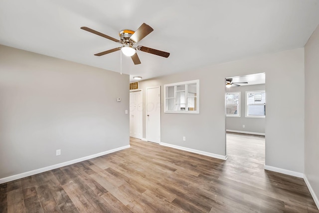 empty room featuring hardwood / wood-style flooring and ceiling fan