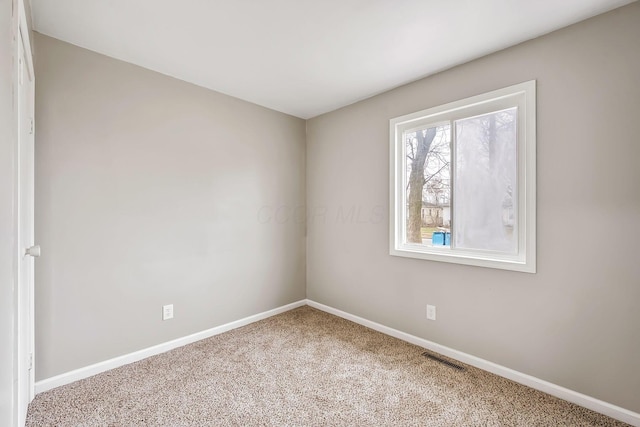 view of carpeted spare room