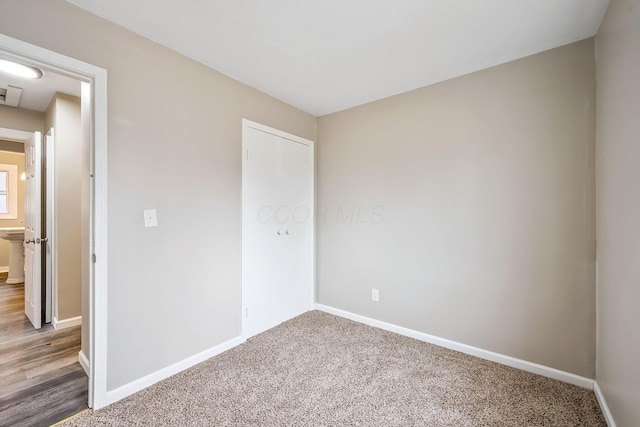 unfurnished bedroom with carpet