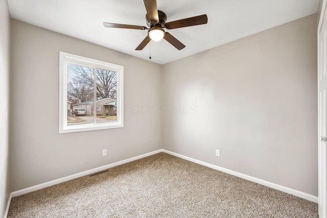 unfurnished room featuring ceiling fan and carpet flooring