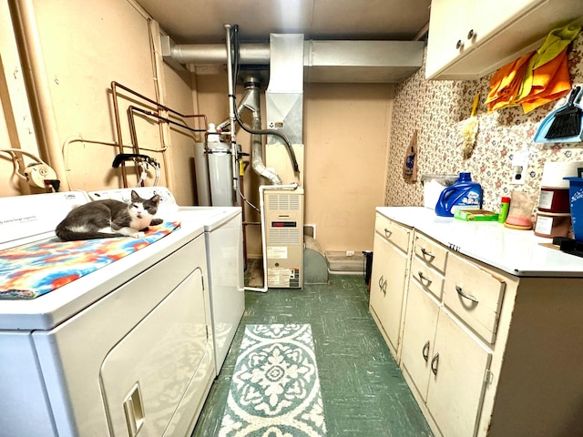 washroom featuring cabinets and washer and dryer