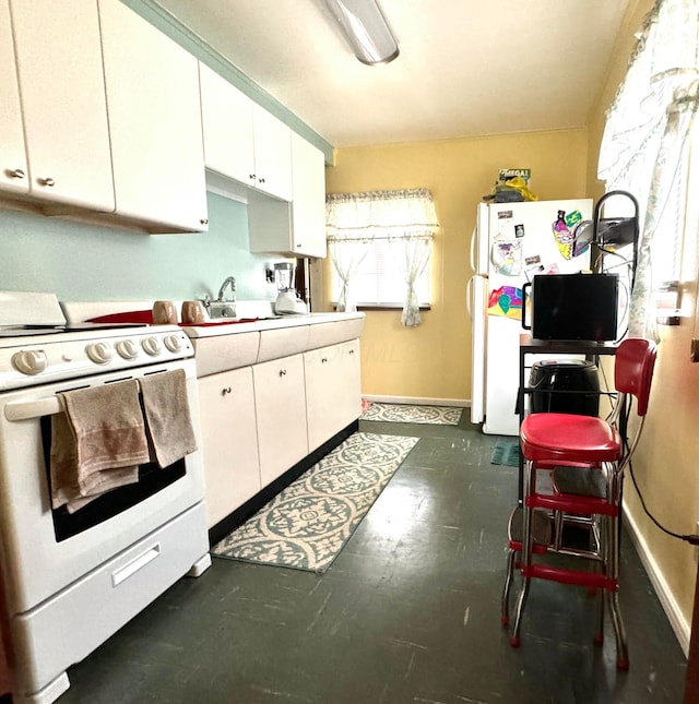 kitchen featuring white cabinetry, white appliances, and sink