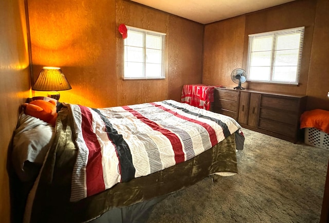 bedroom with multiple windows and carpet floors