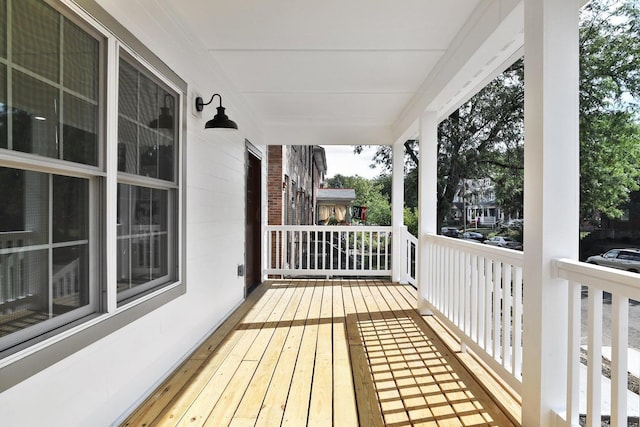 wooden deck featuring covered porch