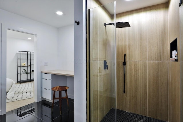 bathroom with a shower with shower door and tile patterned flooring