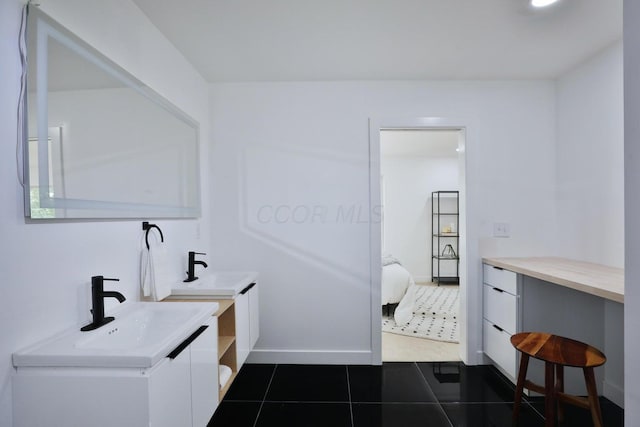 bathroom with vanity and tile patterned floors