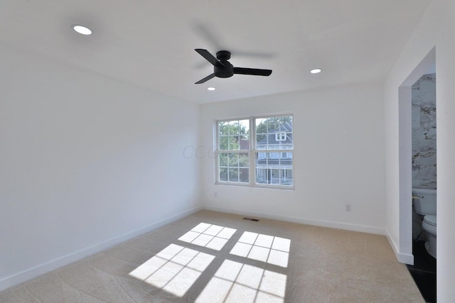 unfurnished bedroom with light carpet and ceiling fan