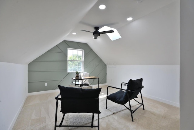 interior space with light carpet, vaulted ceiling, and ceiling fan