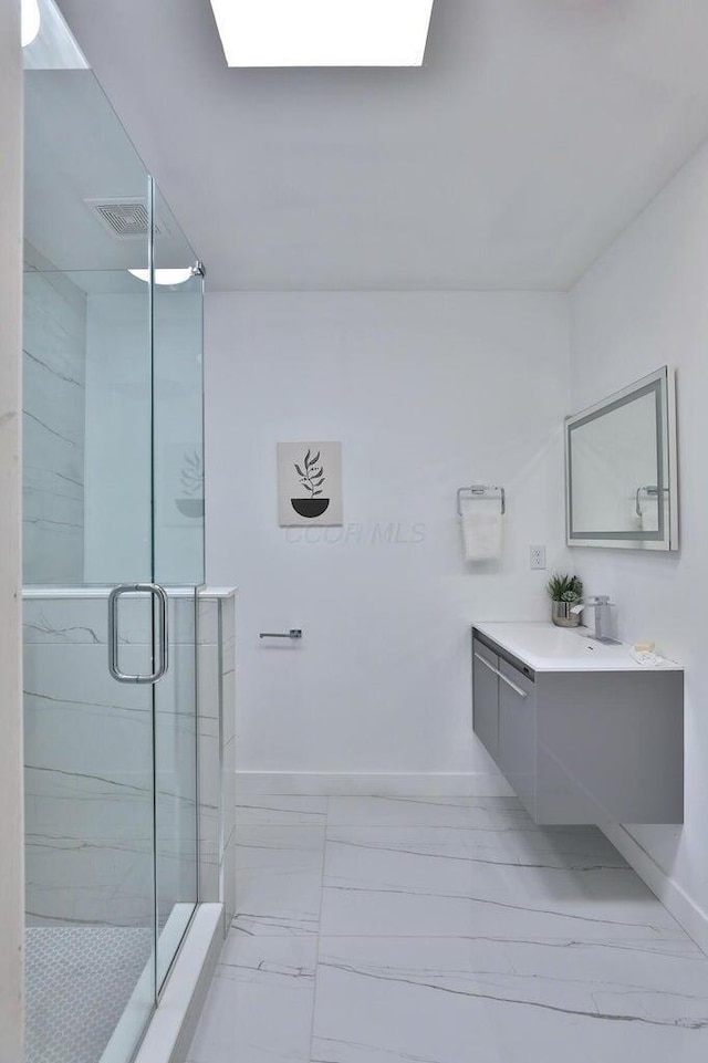 bathroom with vanity and an enclosed shower