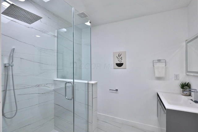 bathroom featuring vanity and a shower with shower door