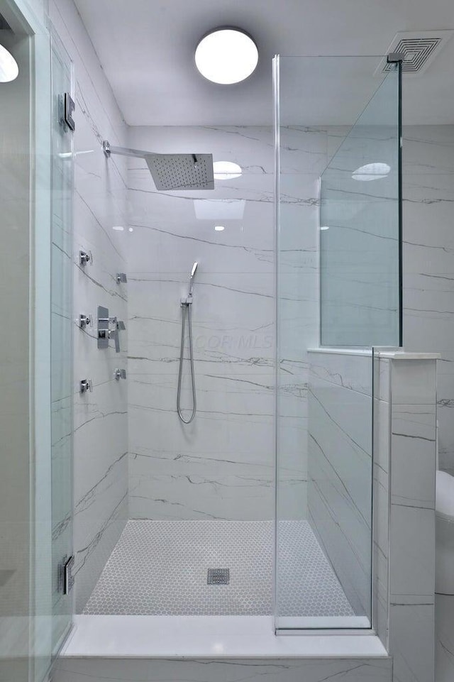 bathroom featuring walk in shower