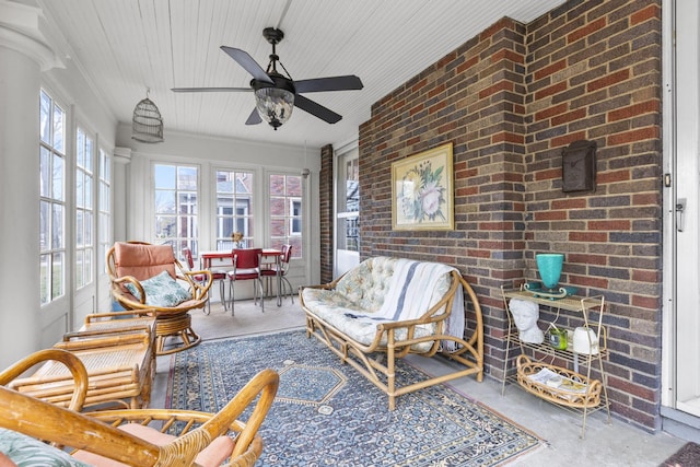 sunroom featuring ceiling fan