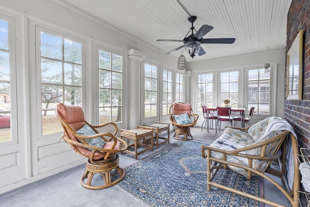 sunroom featuring ceiling fan