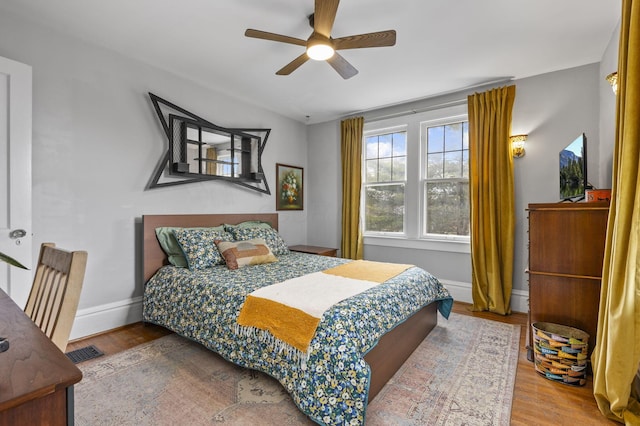 bedroom featuring ceiling fan and hardwood / wood-style floors