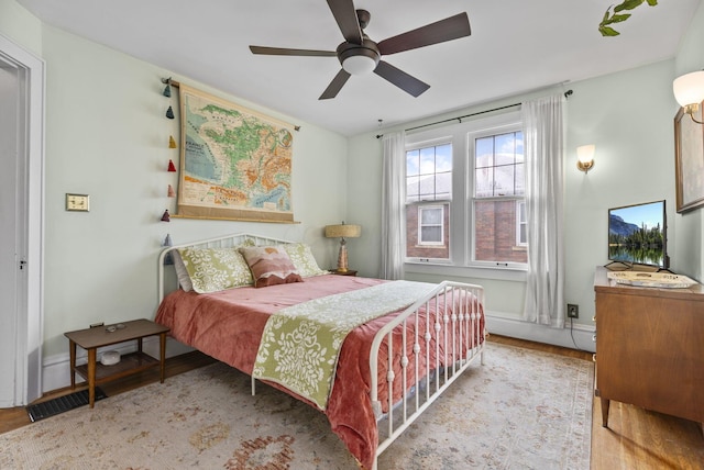 bedroom featuring ceiling fan and light wood-type flooring