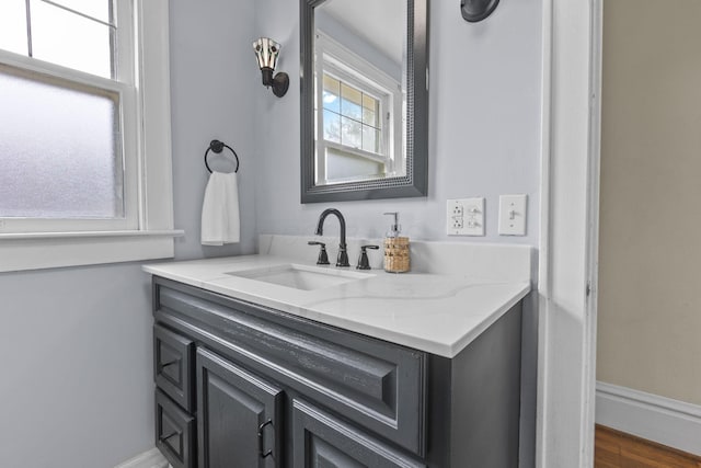 bathroom featuring vanity and hardwood / wood-style flooring