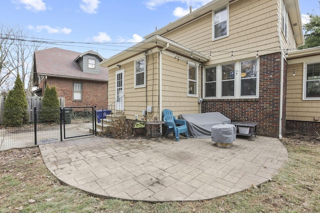 rear view of property featuring a patio