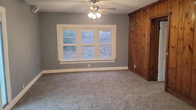 carpeted empty room with ceiling fan