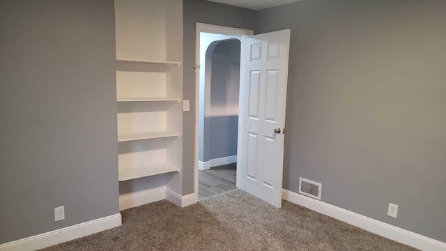 unfurnished bedroom with carpet flooring