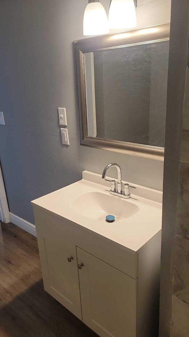 bathroom featuring vanity and hardwood / wood-style floors