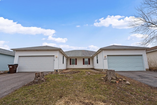 ranch-style house with a garage and a front yard