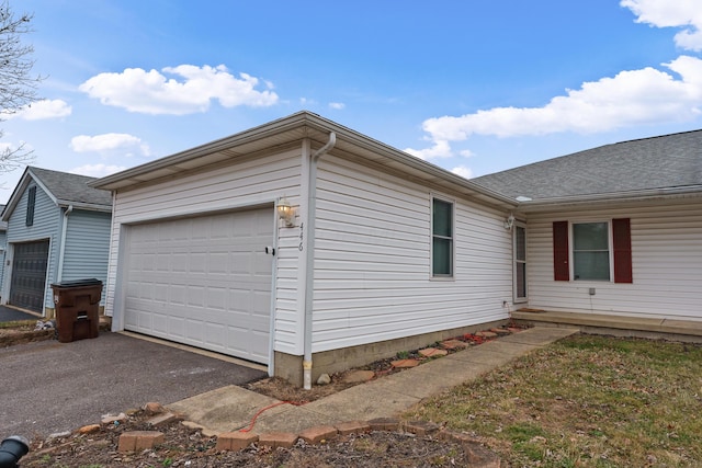 view of property exterior featuring a garage