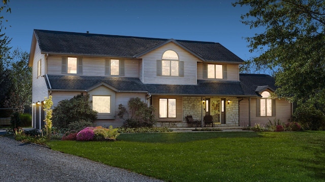 view of front facade featuring a yard and a porch