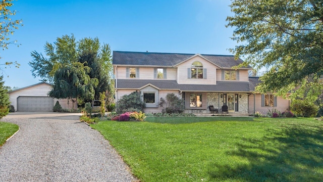 view of front of home featuring a garage and a front yard