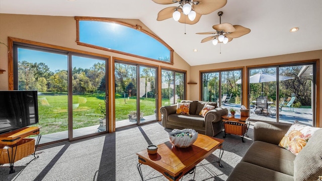 living room with ceiling fan and high vaulted ceiling