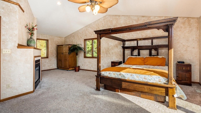 carpeted bedroom with ceiling fan and lofted ceiling