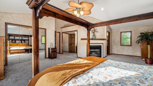 carpeted bedroom featuring lofted ceiling with beams