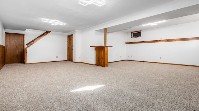 basement featuring light carpet