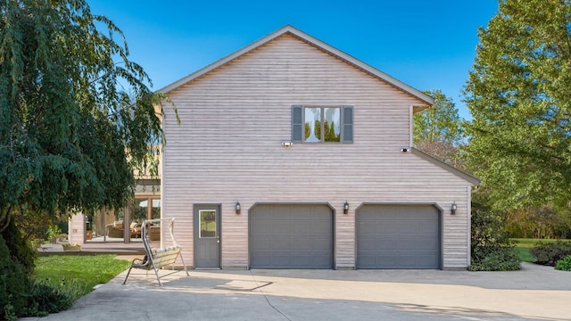 view of side of home with a garage