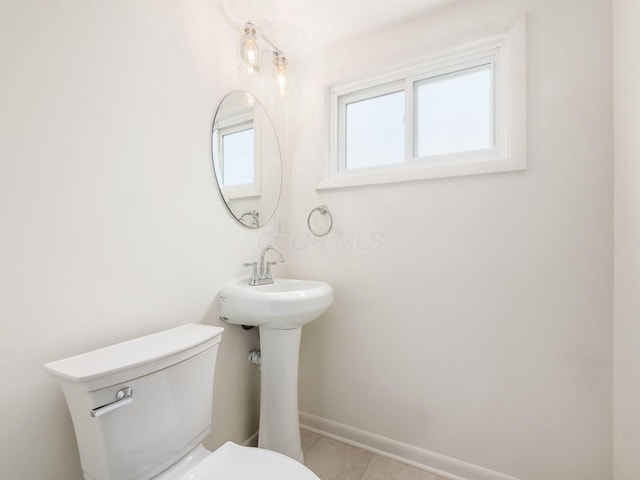 bathroom featuring tile patterned floors and toilet