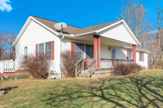 bungalow-style home with a front yard and a porch