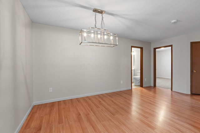 spare room with light wood-type flooring