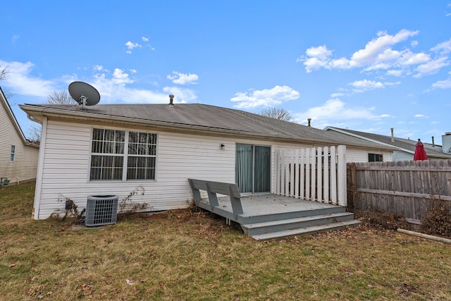 back of house with a yard, central AC, and a deck