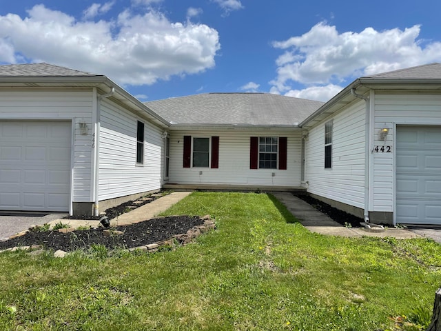 442 Courtland Ln, Pickerington, OH 43147 - view of front of house with a garage, a front yard, and roof with shingles