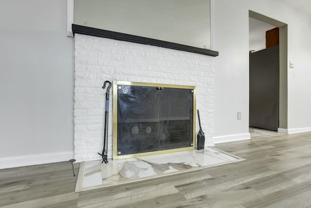 details featuring wood-type flooring and a fireplace