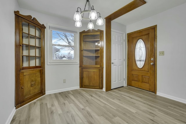 foyer entrance with light hardwood / wood-style flooring