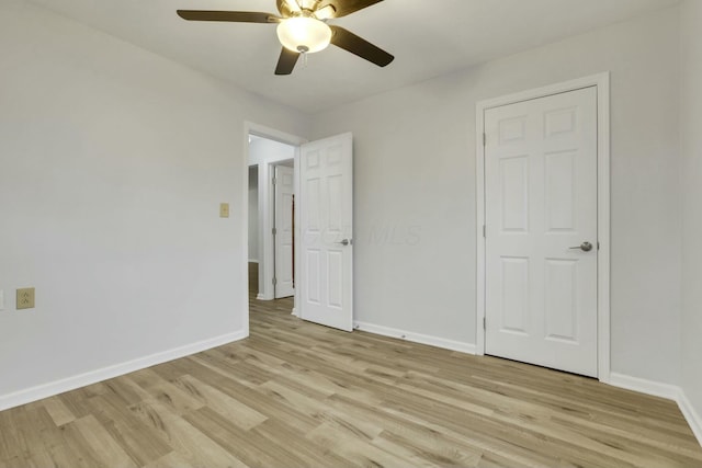 unfurnished bedroom with light hardwood / wood-style flooring and ceiling fan