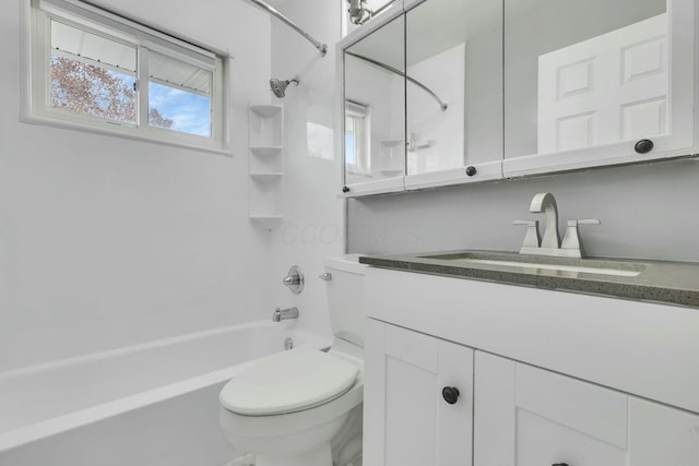 full bathroom featuring vanity, toilet, and washtub / shower combination