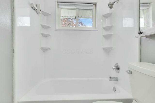 bathroom with toilet and tub / shower combination