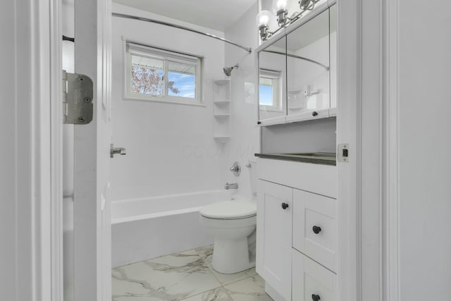 full bathroom featuring washtub / shower combination, vanity, and toilet