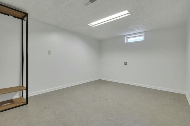 empty room with a textured ceiling