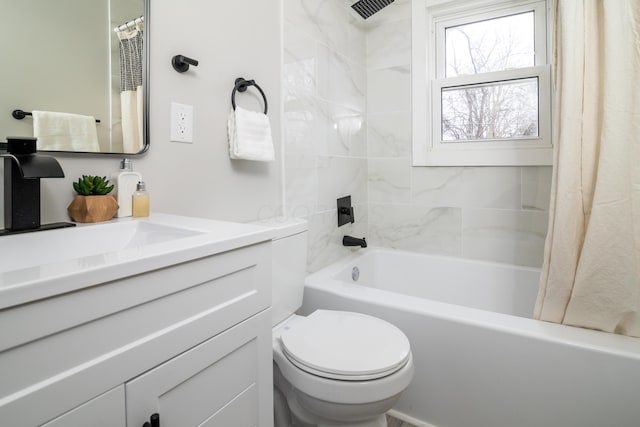 full bathroom featuring vanity, shower / bath combination with curtain, and toilet