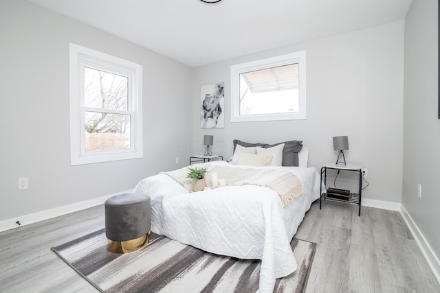 bedroom with light wood-type flooring