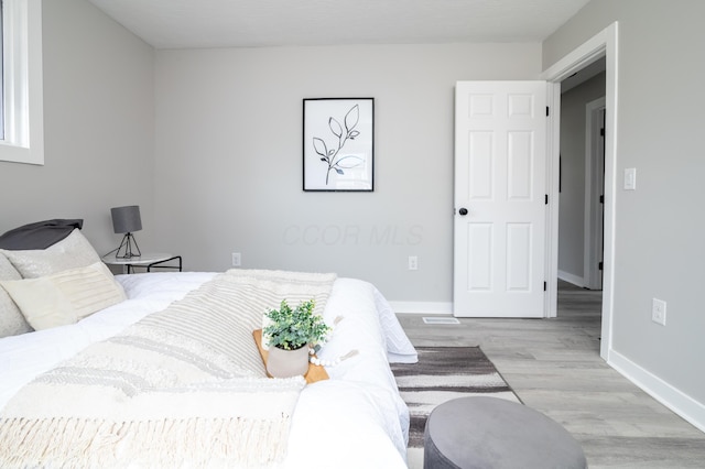 bedroom featuring light wood-type flooring