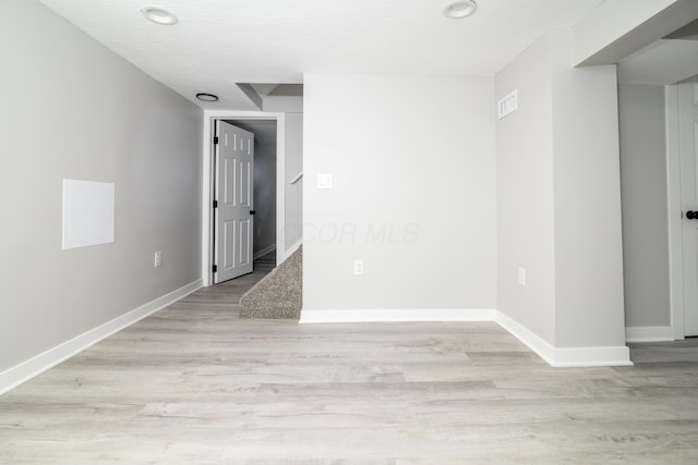 unfurnished room featuring light hardwood / wood-style floors